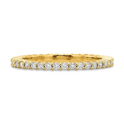 Product image of yellow gold shared-prong eternity band by Precision Set