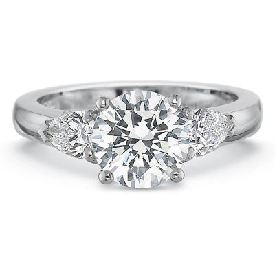 Product image of white gold 3-stone engagement ring with round center and pear shaped sides by Precision Set