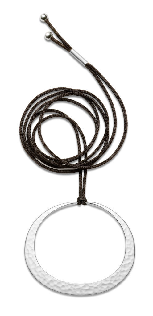 product image of white circle pendant on black cable from Toby Pomeroy