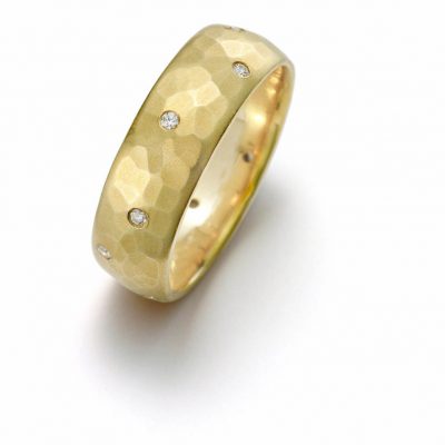 product image of yellow gold hammered band with diamonds from Toby Pomeroy