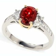 product image of oval ruby ring with side diamonds in mixed metals