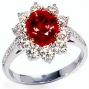 product image of ruby ring with diamond halo in mixed metals