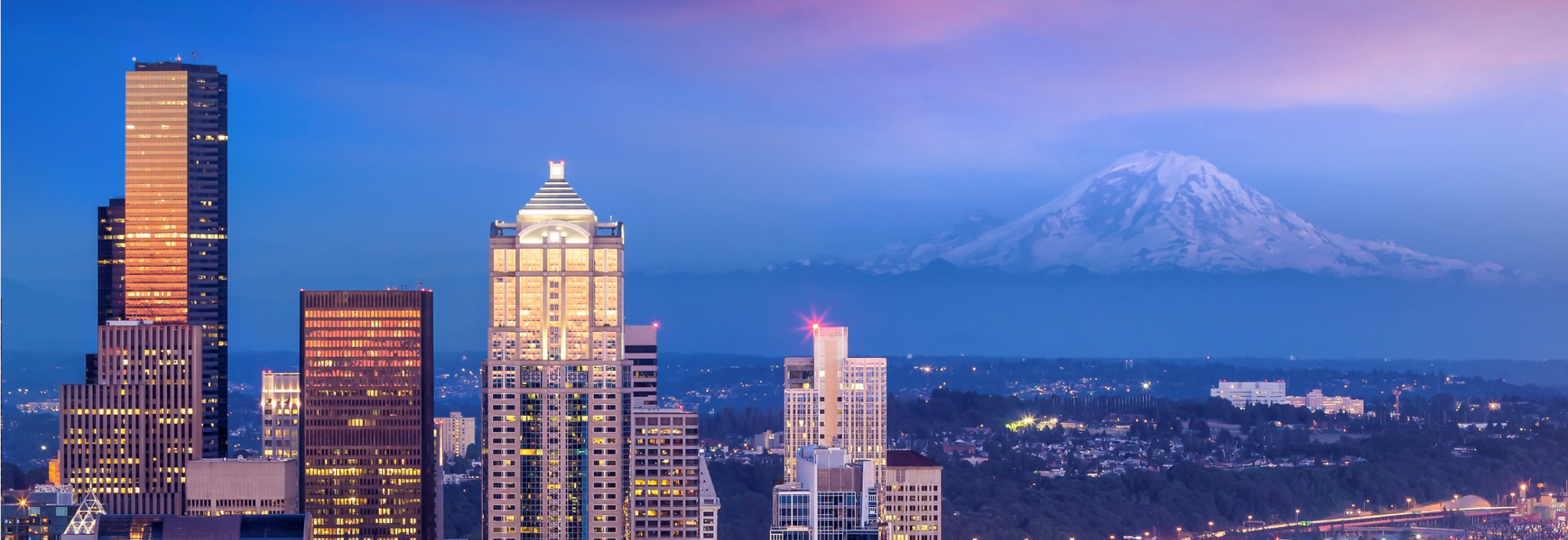 Image of downtown Seattle overlooking Mt. Rainier at dusk