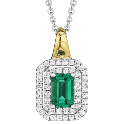detail shot of Spark Creations emerald cut emerald pendant with double diamond halo and yellow gold bail