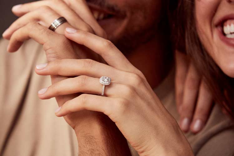 smiling couple with wedding rings