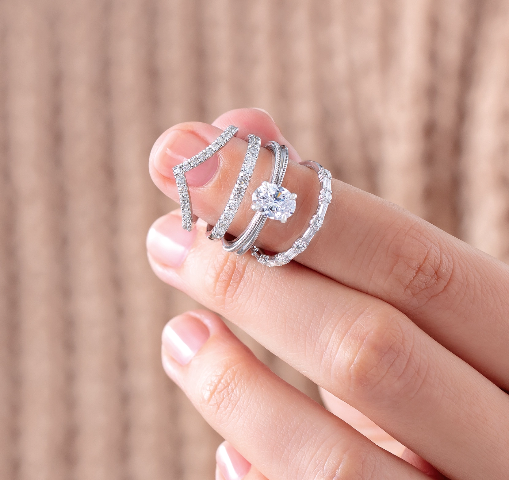 Asset 1 woman's hand holding a natural diamond ring