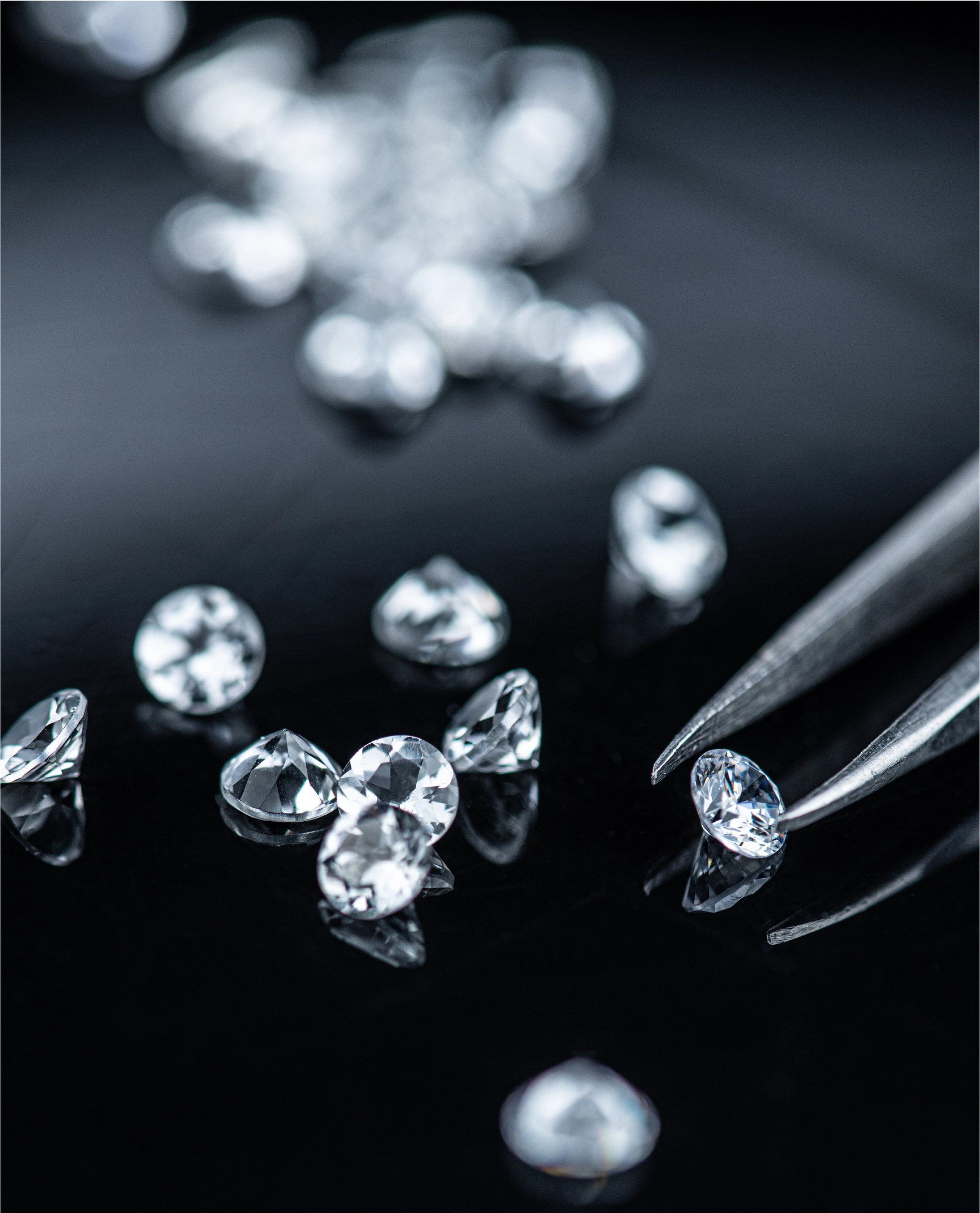 Asset 1 cut diamonds being examined by a professional