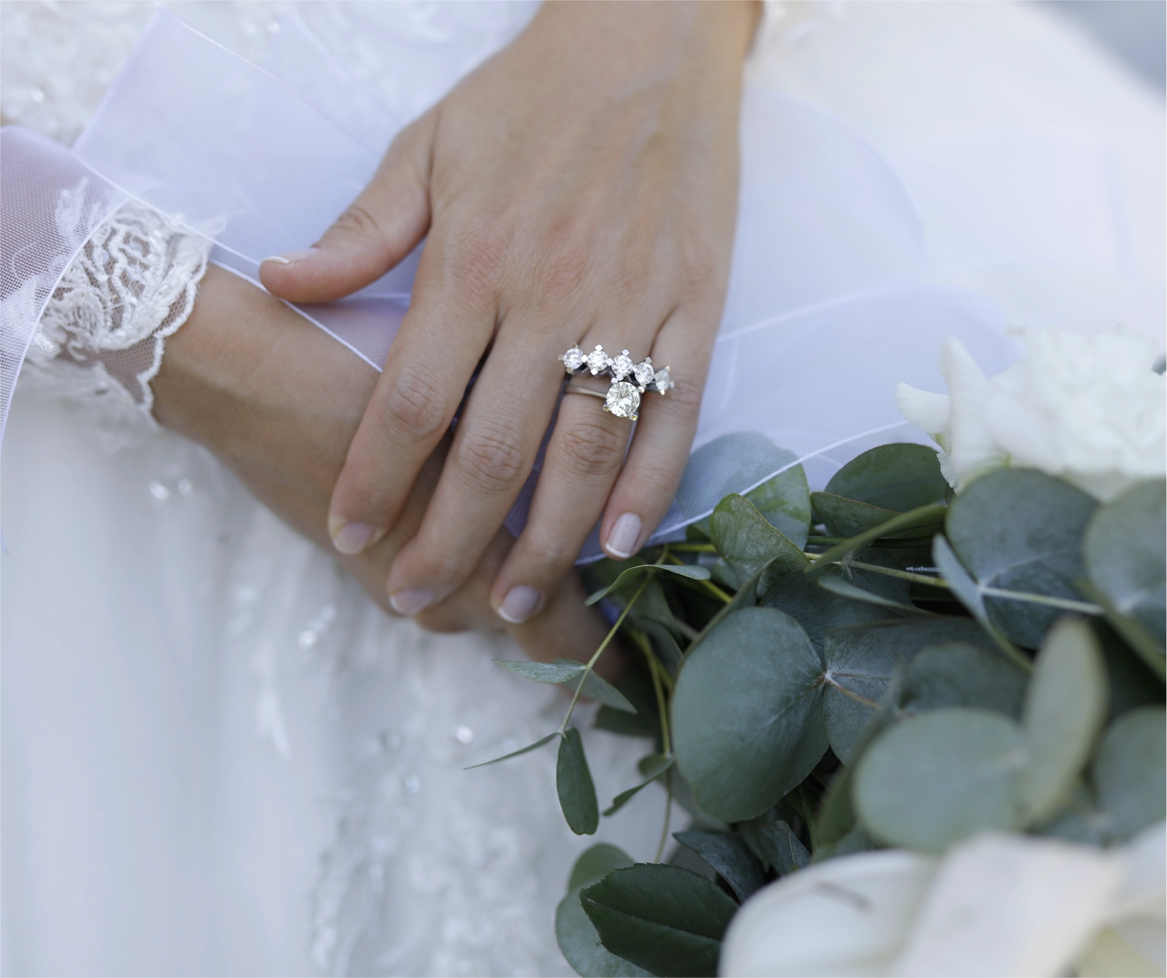 Asset 4 bride hand wearing beautiful natural diamond ring